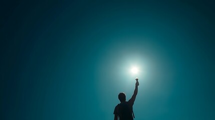 A man in motion, reaching for the sun, symbolizing hope and aspiration.