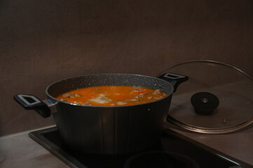 Warm soup simmering in cooking pot