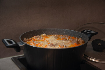 Traditional pilaf preparation in pot