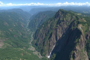High-angle view of a valley with mountains, forests, and a waterfall