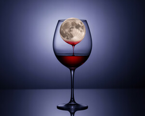 Full moon in a wine glass, creating a surreal and captivating image