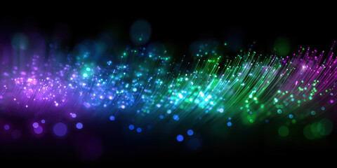 Obraz premium Vibrant display of colorful fiber optic lights creates mesmerizing and futuristic atmosphere against dark background. glowing strands shades of purple, blue, and green evoke sense of wonder