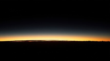 Aerial View of a Sunset Over the Horizon at Night