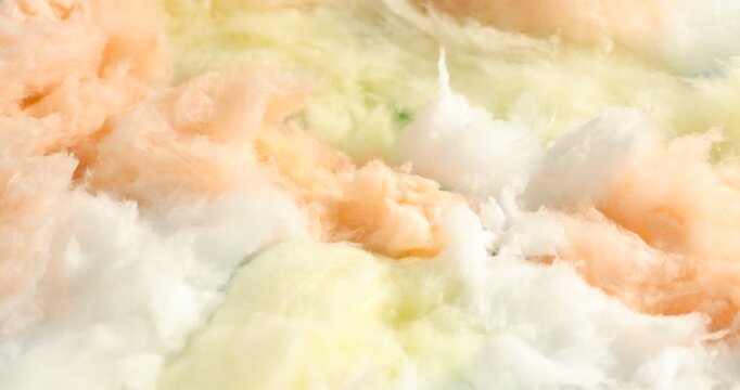 Colorful cotton candy as background, closeup. Camera zooming in