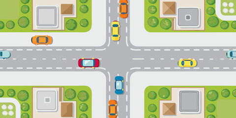 Aerial view of a suburban intersection with cars driving on roads and houses with green lawns