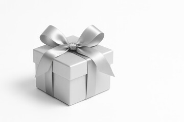 Obraz premium Shimmering silver gift box with lush satin bow isolated on pristine white background elegant product mockup with soft shadow premium holiday present vibe