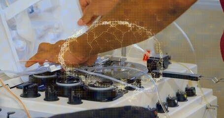 Technician hands in red shirt adjusting tubing in med lab with apheresis machine and data overlay