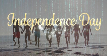 Running eight friends in swimwear holding hands at beach, gold Independence Day text green overlay