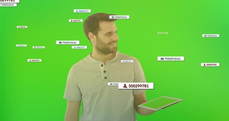 Male wearing henley shirt displaying floating overlays with icons on tablet in green backdrop set