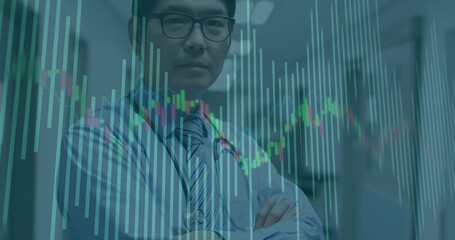 Crossing arms, Asian doctor viewing candlestick chart in hospital corridor, with stethoscope
