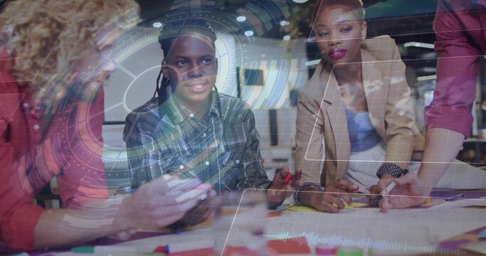 Collaborating group wearing casual attire designing at office table, with markers and AR overlay - Powered by Adobe