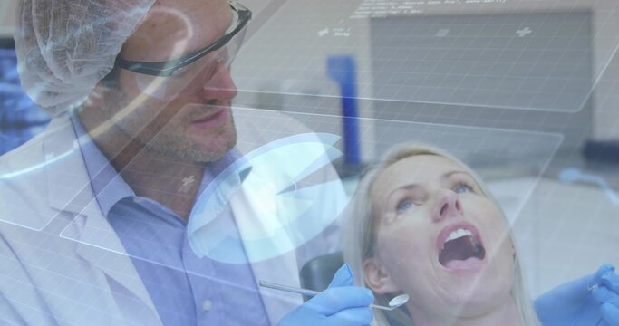 Examining dentist wearing PPE holding mirror and probe on patient in dental chair with AR overlays