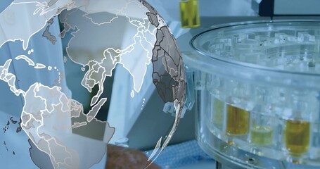 Lab technician in lab coat adjusting centrifuge rotor at bench, test tubes and world map overlay