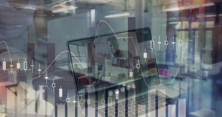 Displaying laptop showing executive in suit pointing during meeting in office, with chart overlay