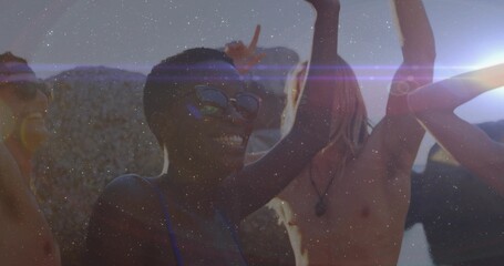 Smiling friends dancing on rooftop at sunset, with sunglasses pendant swim top sleeveless tops
