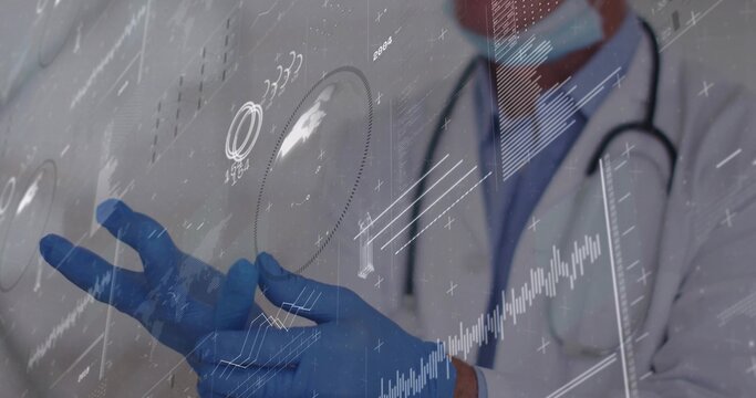 Interacting senior male doctor using holographic charts in lab, with stethoscope and blue gloves