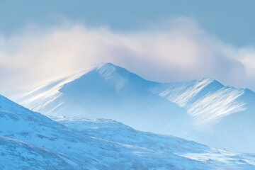Snowy Mountain Range Under Winter Light
