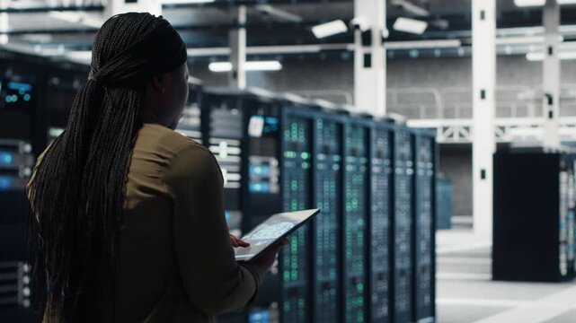 Data center software developer doing AI data analysis on tablet to upgrade infrastructure. Server hub IT expert using device to manage storage systems for deep learning training datasets - Powered by Adobe