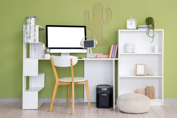 Interior of office with inventor's workplace and shelf unit