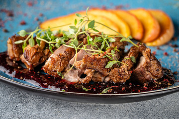 Closeup of roasted duck breast with apples and red wine sauce