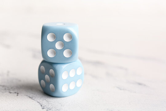 Blue dices on light background