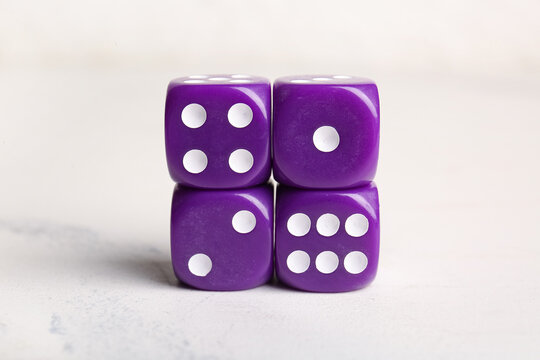 Purple dices on light background