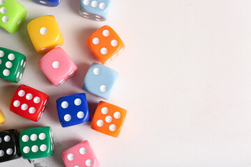 Many colorful dices on light background