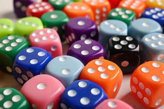 Many colorful dices, closeup view