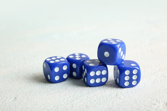 Blue dices on light background