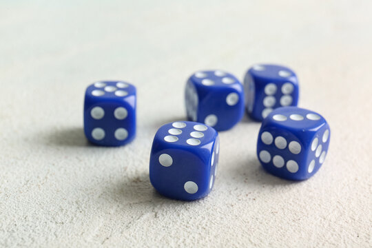 Blue dices on light background