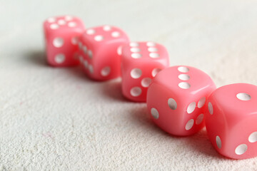 Pink dices on light background