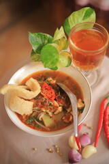 Bowl of Authentic Soto Ayam with Shredded Chicken and Aromatic Spices