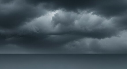 A turbulent and heavy grey cloud front fills the sky, heralding an approaching storm. A minimalist and powerful weather background.