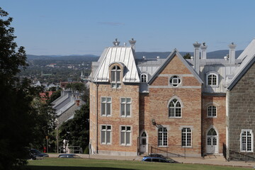 A view in summer of the Old Quebec in Canada with ancient architecture. Panorama of the old Quebec with ancient building. Historic building in Quebec city. Tourism and destination.