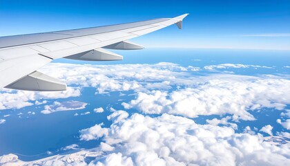 Fototapeta premium Aerial view of clouds and ocean from airplane