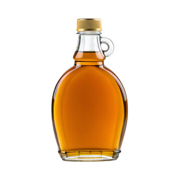 Glass Bottle With Handle Filled With Amber Syrup and Gold Cap maple syrup liquid