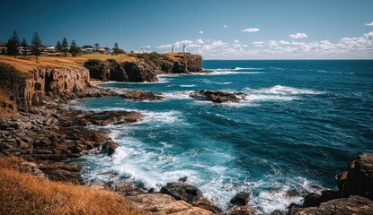 Obraz premium Coastal cliffs meet crashing waves