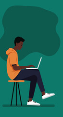 Young Black man working remotely on a laptop, comfortably seated on a bean bag chair. Ideal for freelance, online education, and modern flexible work lifestyle.