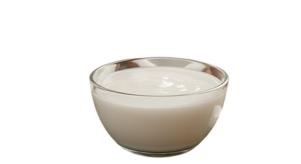 A clear glass filled with creamy white liquid and a frothy top against a stark black background