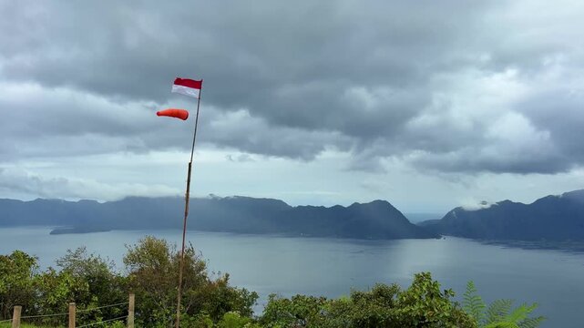 Lake Maninjau view from Puncak Lawang with Indonesian Flag