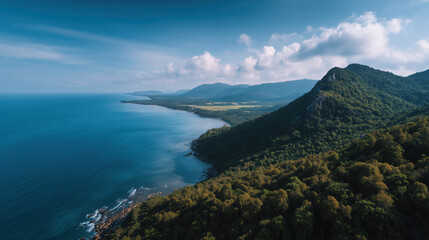 Fototapeta premium Scenic Coastal Landscape with Mountains and Lush Greenery Under Blue Sky