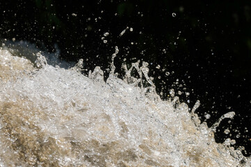 Abstract texture background of waterfall splashes. Waterfall in tropical forest mountains. Copy space for text. Ecology and environmental concept. For graphic design, 3D rendering and web banners