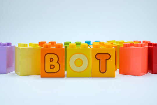 Colorful toy blocks spelling the word BOT on a clean white background. Perfect for illustrating AI, chatbots, and automation concepts in creative projects