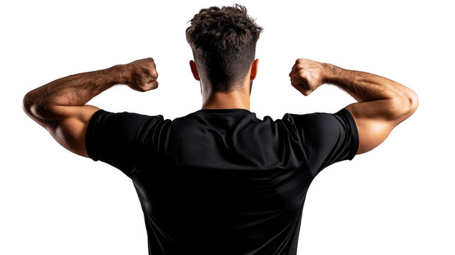 Back view of a muscular man in a black shirt flexing his arms against a black background in studio light