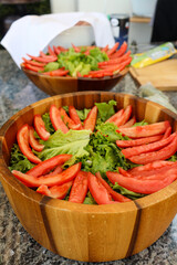 Fresh Tomato and Lettuce Salad in a Wooden Bowl