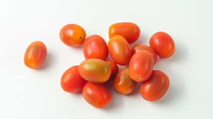 some cherry tomatoes on a white background
