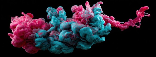 Abstract image of pink and teal ink swirling in water against a solid black background, creating a dreamy, cloud-like effect