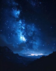 Milky Way graces mountains under a deep blue night, starry expanse with peaks in darkness. Ethereal beauty meets terrestrial forms