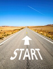 Long desert road, blue sky, white "start" and arrow marking the path ahead, emphasizing journeys and new beginnings