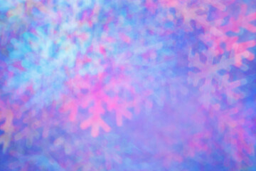 Defocused abstract figured bokeh background, glare from lights as snowflakes, blurred snowflake bokeh as winter holiday texture. Creative New Year aesthetic textured lighting pattern for festive